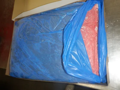 Frozen poultry MDM block in a PE bag inside a carton